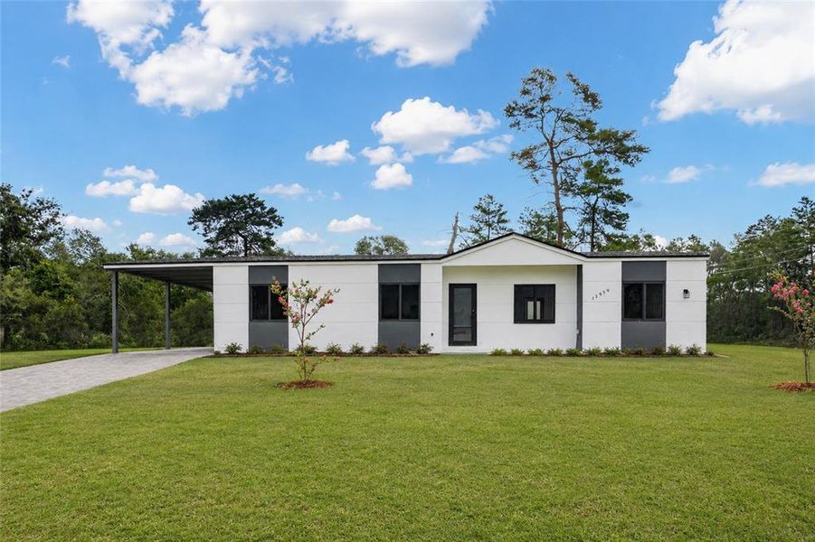 Front exterior of a new home in , Ocala, FL, highlighting curb appeal (Image 13).