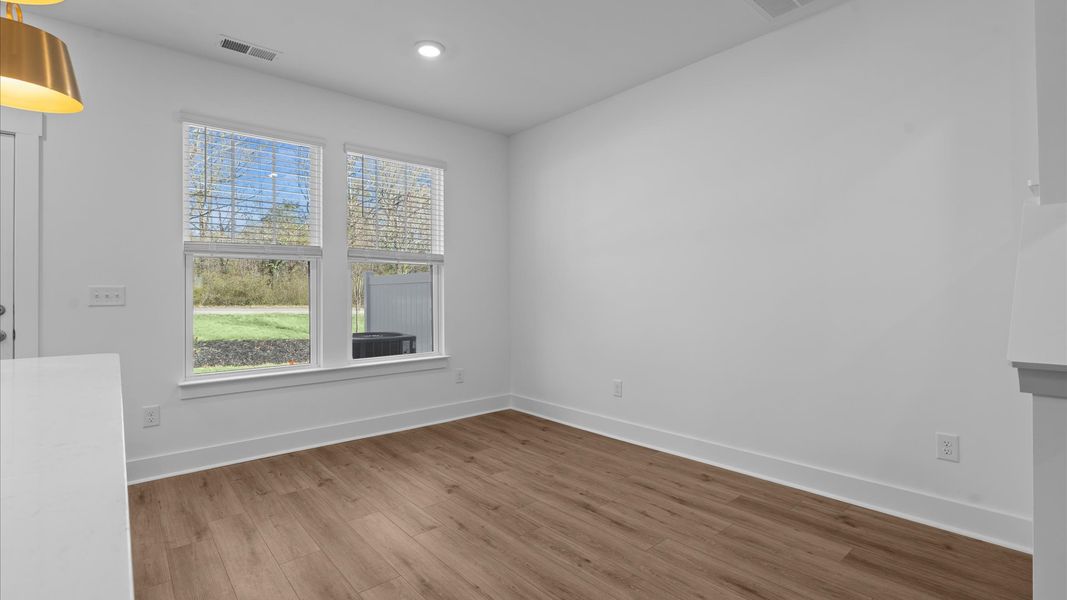 Open-concept breakfast area with thoughtful flow—perfect for entertaining in this first-class townhome in Simpsonville, SC