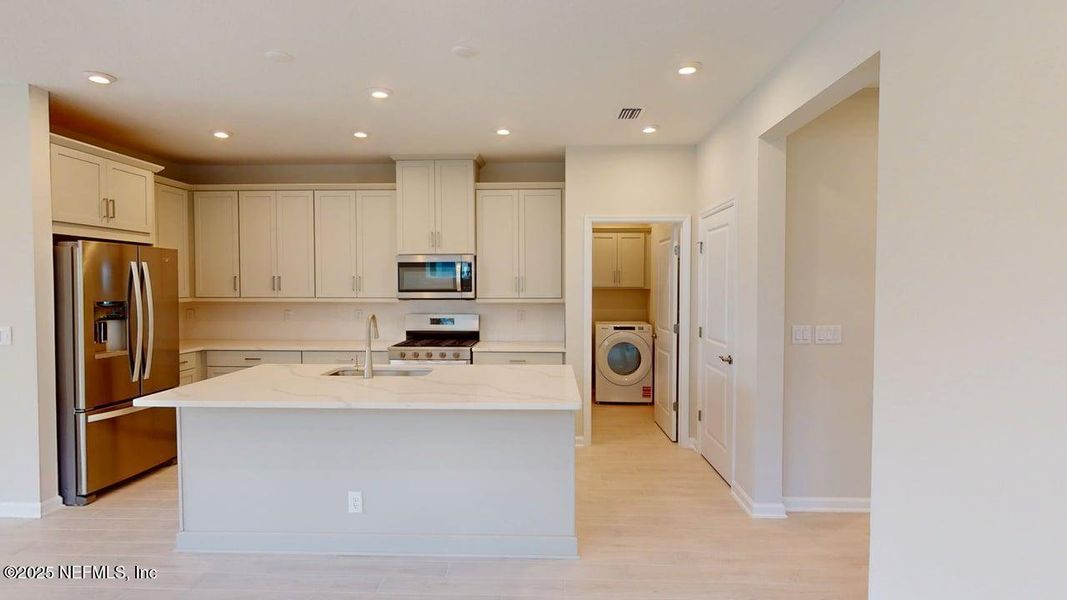 Furnished interior view inside a new home in RiverTown - WaterSong, St. Johns (Image 8).