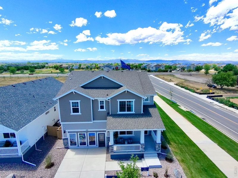Front exterior of a new home in Trevenna, Windsor, CO, highlighting curb appeal (Image 22).
