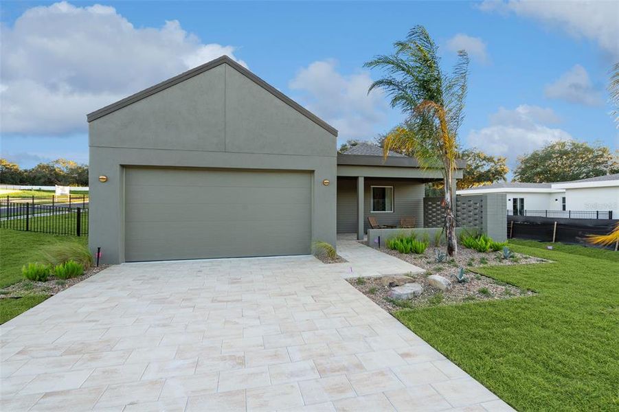 Front exterior of a new home in , Lady Lake, FL, highlighting curb appeal (Image 2). Front exterior of a new home in , Lady Lake, FL, highlighting curb appeal (Image 2).