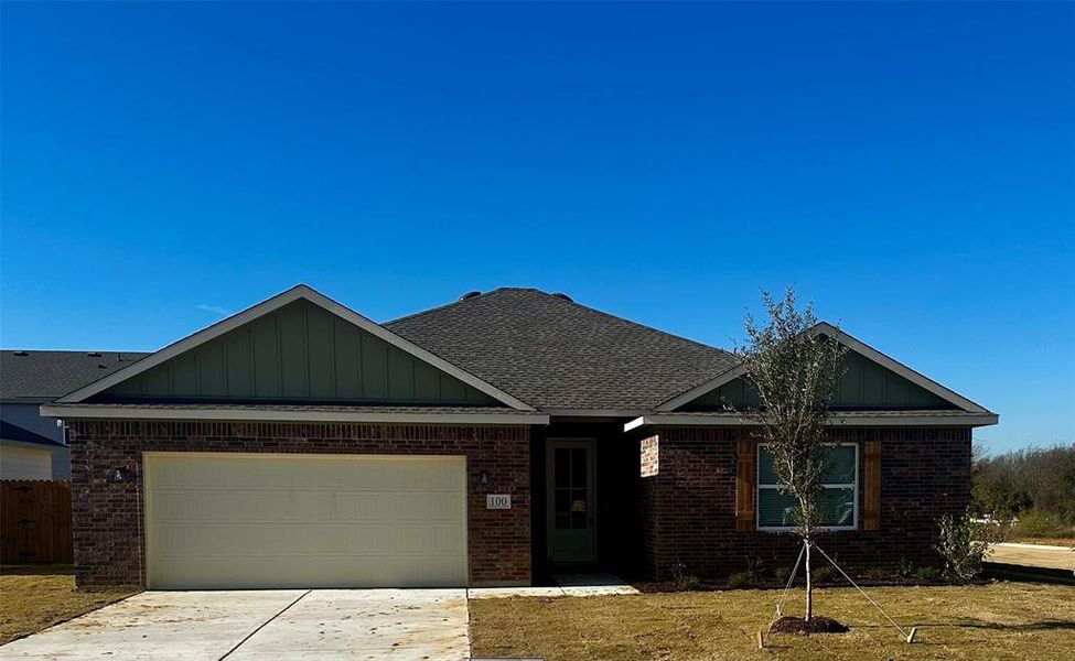 View of front of property featuring a garage