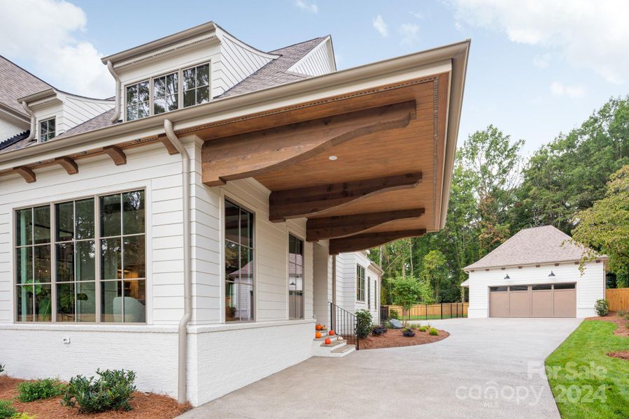 A porte cochere for covered parking and side entrance