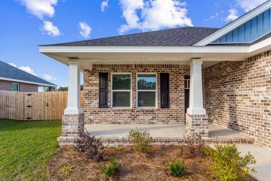 Representative exterior photo of a completed home built from the The Carlos by Herbst Homes in Doyle Hawkins Landing, Navarre, FL (Image 33).