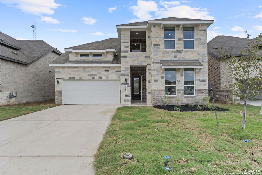 Front exterior of a new home in , New Braunfels, TX, highlighting curb appeal (Image 1).