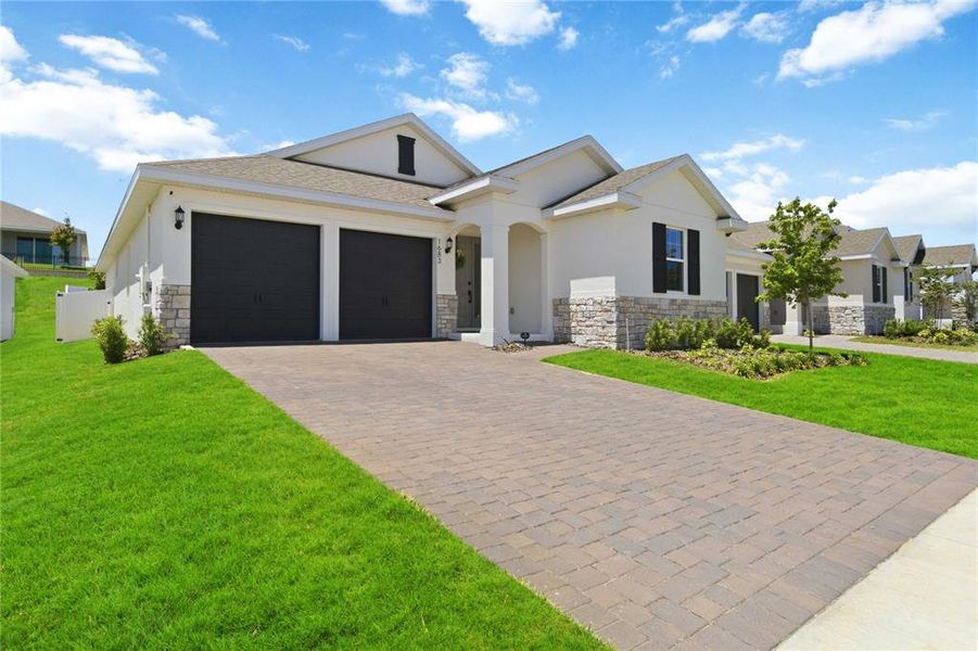 Front exterior of a new home in , Clermont, FL, highlighting curb appeal (Image 22).