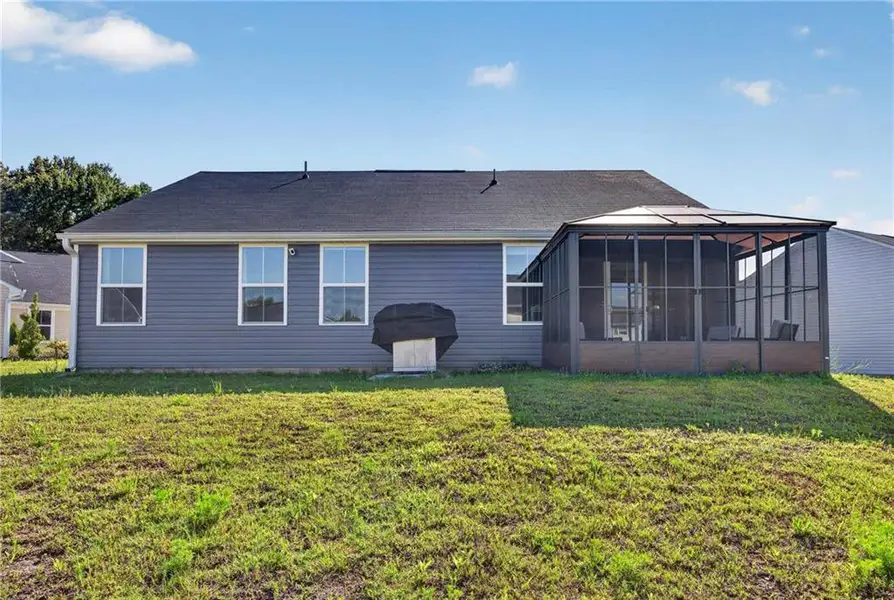 Exterior details and patio area of a home in Riverside at Calhoun, Calhoun (Image 24).