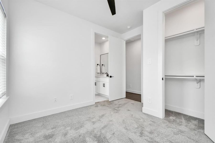 This secondary bedroom is complete with a walk-in closet, and adjoining jack and jill bathroom.