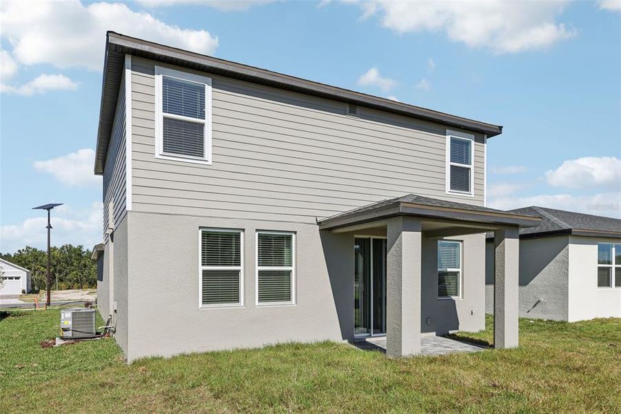 Exterior details and patio area of a home in The Reserve at Hammock Oaks - Classic Series, Lady Lake (Image 27).