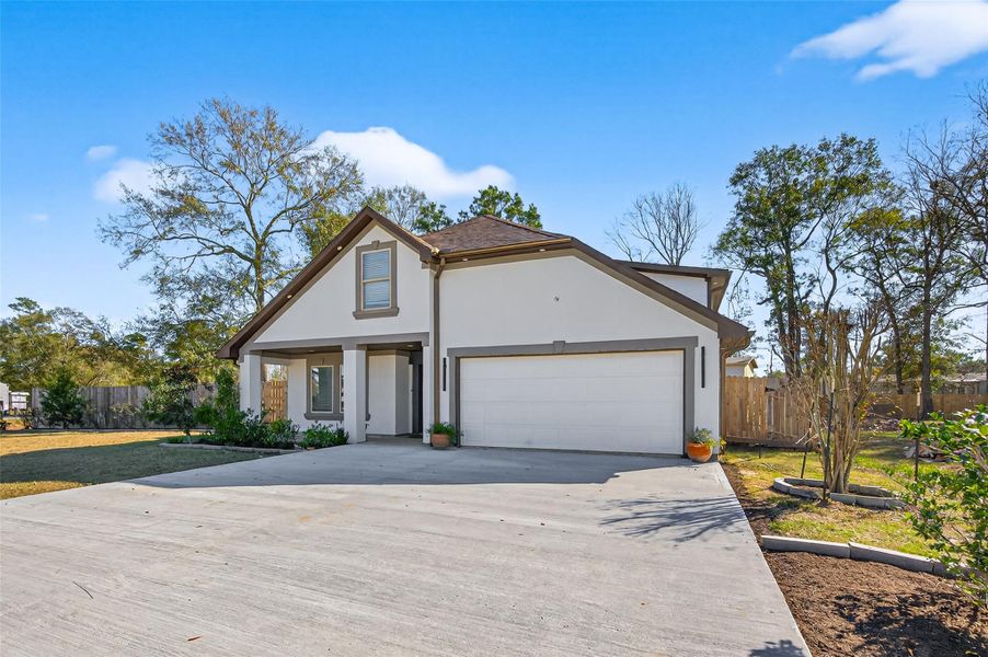 Front exterior of a new home in , Conroe, TX, highlighting curb appeal (Image 26). Front exterior of a new home in , Conroe, TX, highlighting curb appeal (Image 26).