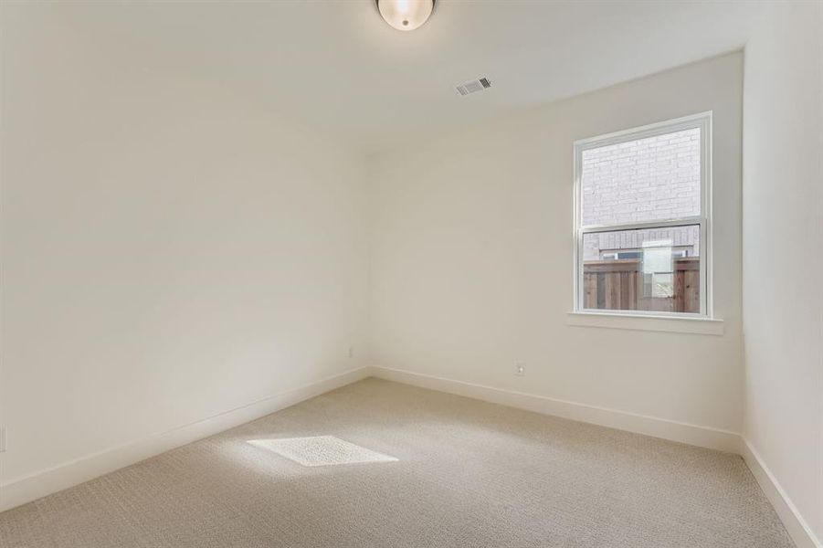 Empty room featuring carpet floors and baseboards Empty room featuring carpet floors and baseboards