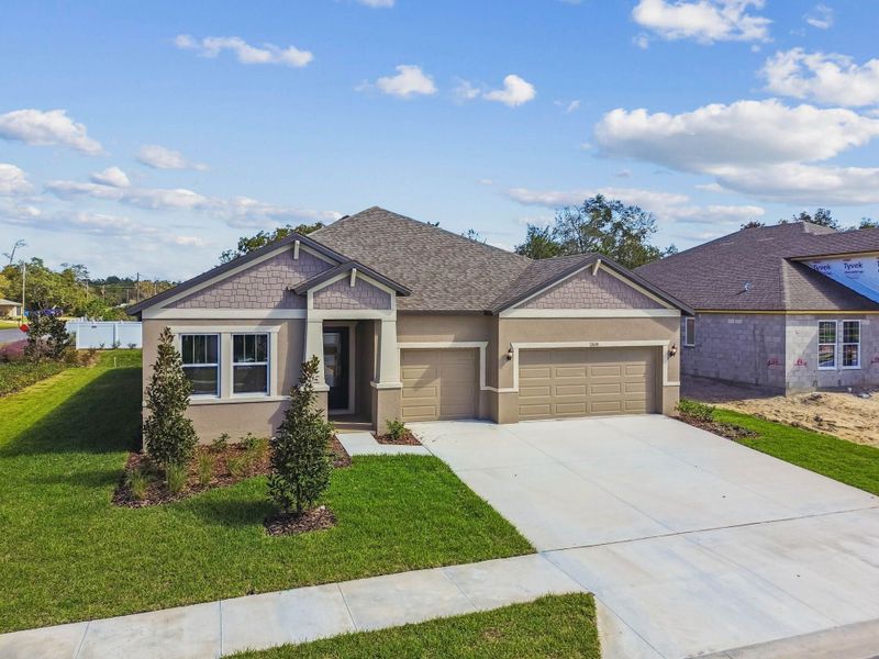 Front exterior of a new home in Pinecone Reserve, Brooksville, FL, highlighting curb appeal (Image 29).
