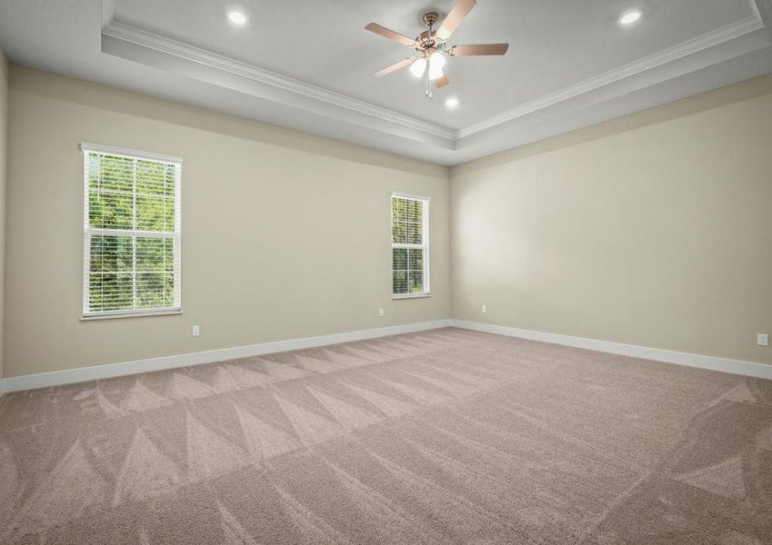 Master bedroom with carpet.