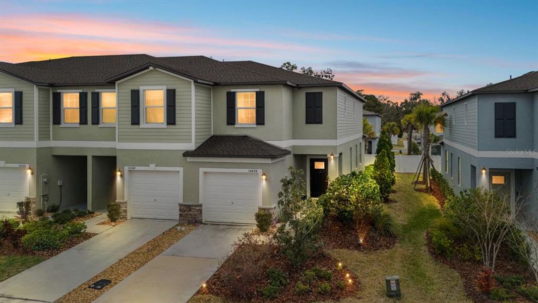 Front exterior of a new home in , Zephyrhills, FL, highlighting curb appeal (Image 2). Front exterior of a new home in , Zephyrhills, FL, highlighting curb appeal (Image 2).