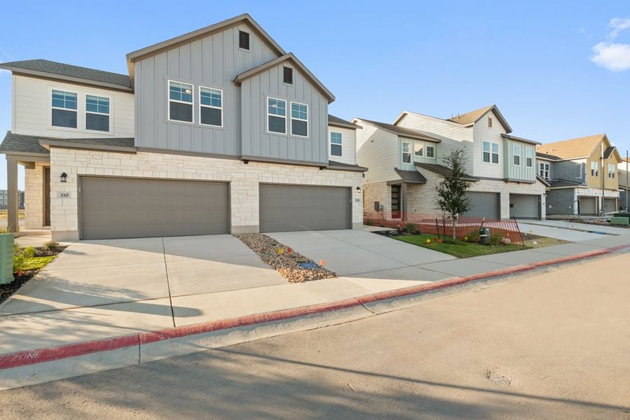 Front exterior of a new home in Union Collection at Park Central, Georgetown, TX, highlighting curb appeal (Image 25). Front exterior of a new home in Union Collection at Park Central, Georgetown, TX, highlighting curb appeal (Image 25).