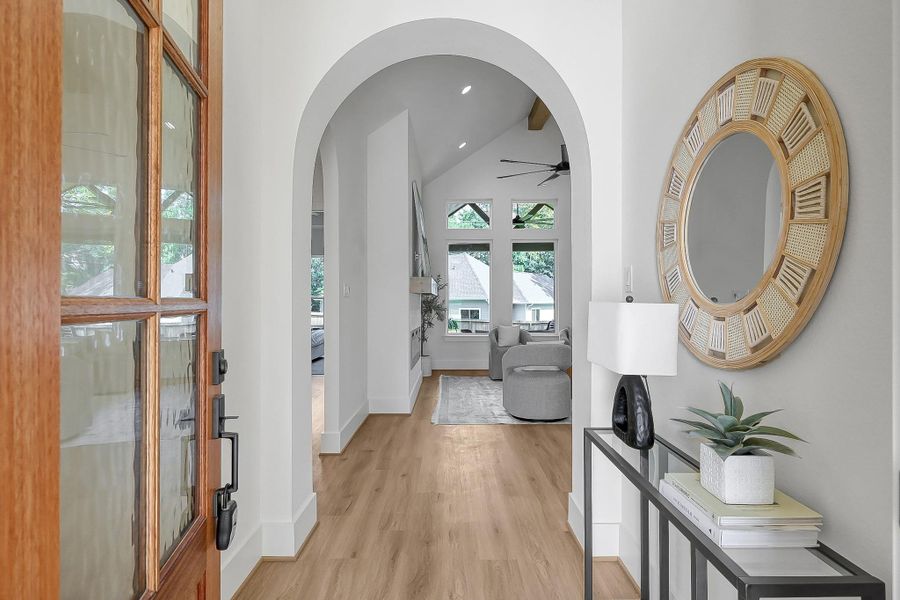 8' wood door and subtle archways to invite you in.