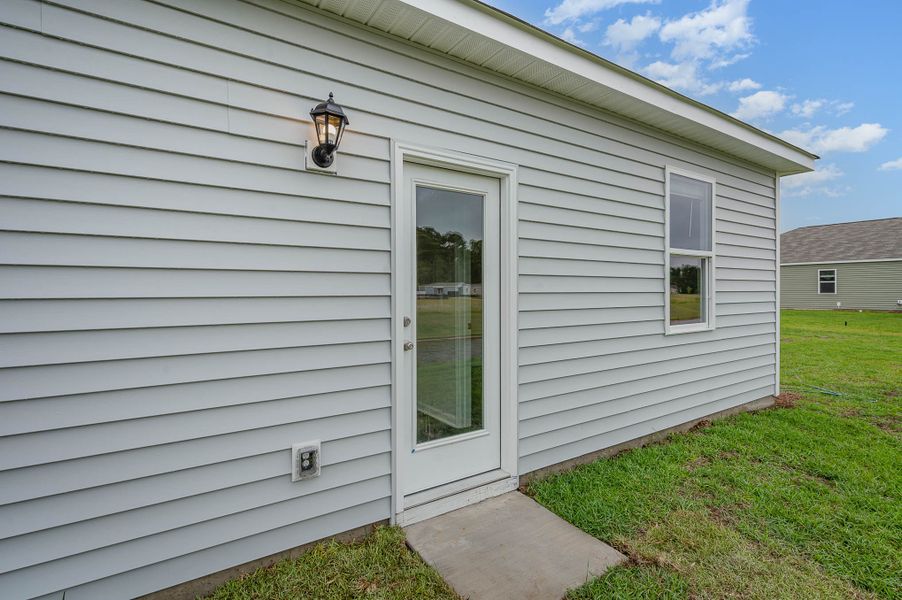 Representative exterior photo of a completed home built from the SULLIVAN by D.R. Horton in Summerville, Darlington, SC (Image 13).