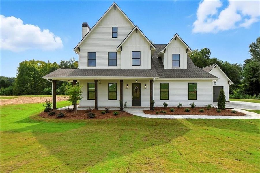 Front exterior of a new home in Old Town Estates, Dacula, GA, highlighting curb appeal (Image 27).