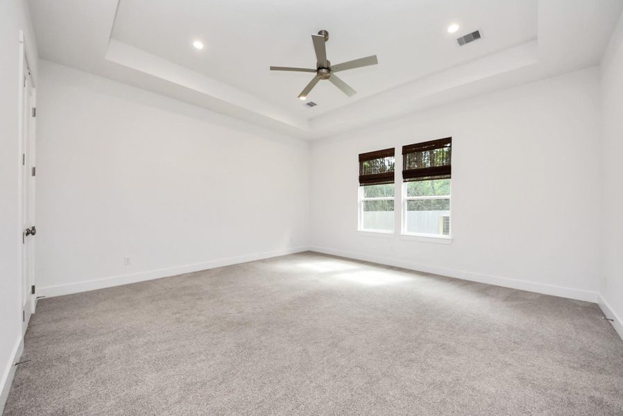 Another view of comfortable primary suite designed for relaxation.