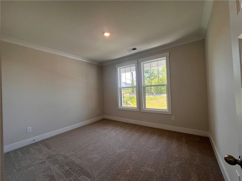 This spacious room features ample natural light an