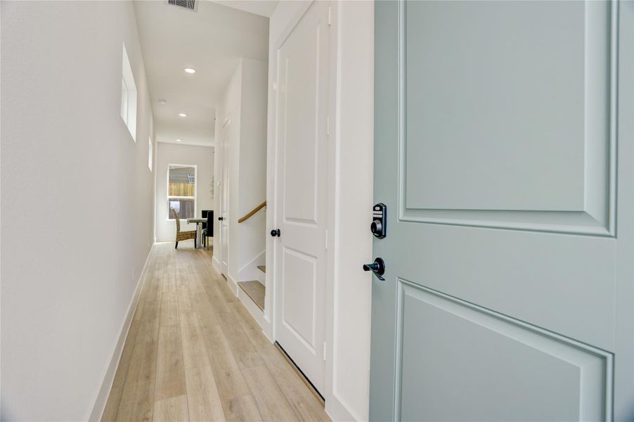 Upon entering, the home has a long gallery hallway - perfect for displaying artwork.