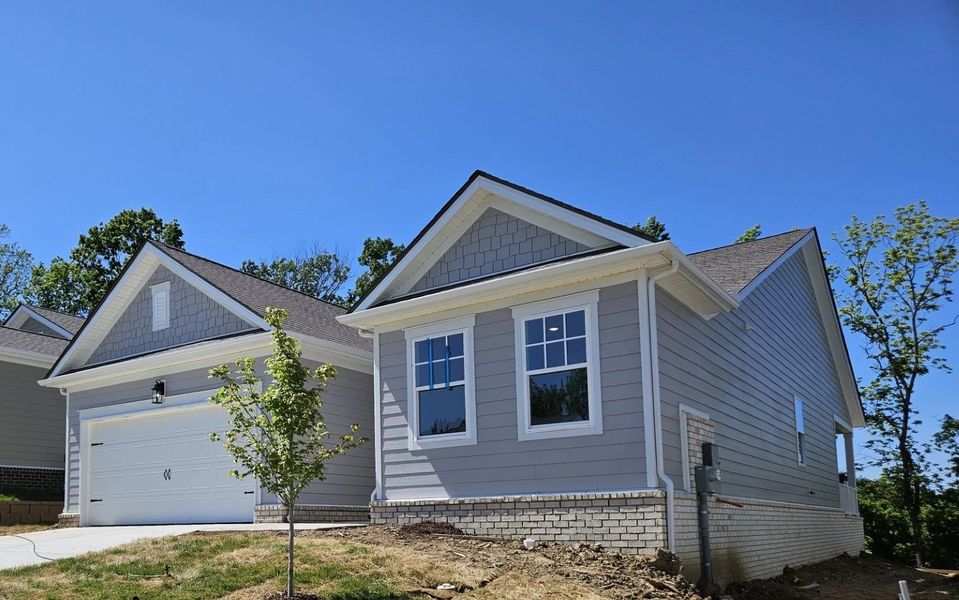 Front exterior of a new home in Cedars of Cane Ridge | 55+ Community, Antioch, TN, highlighting curb appeal (Image 15).