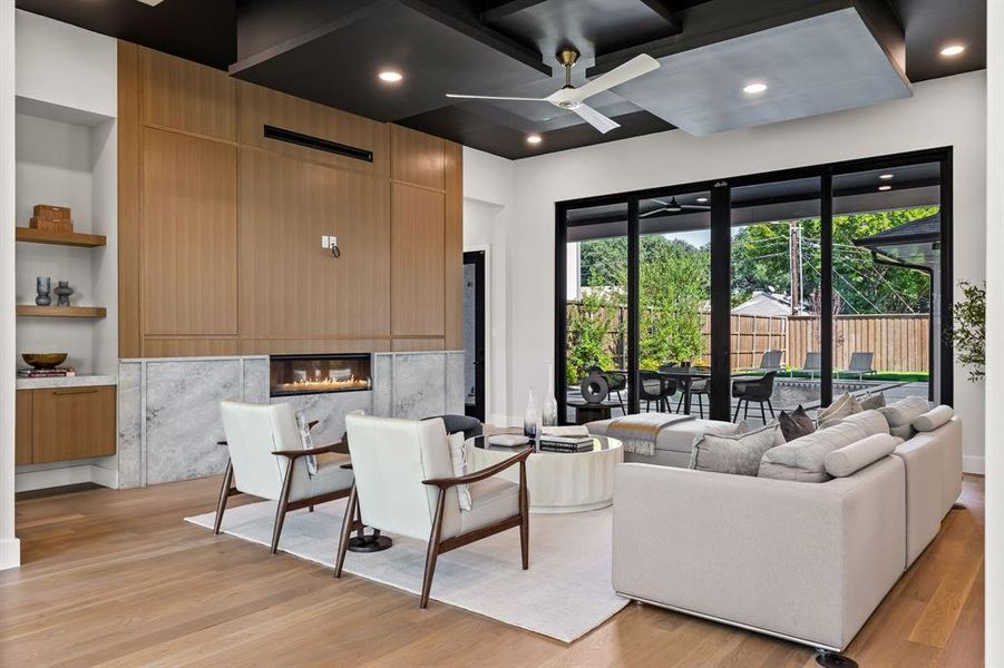 Building lobby featuring coffered ceiling, beam ceiling, and recessed lighting Building lobby featuring coffered ceiling, beam ceiling, and recessed lighting