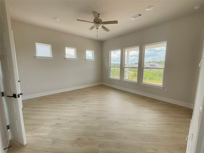 Well-lit living area features abundant natural illumination and durable flooring. Well-lit living area features abundant natural illumination and durable flooring.