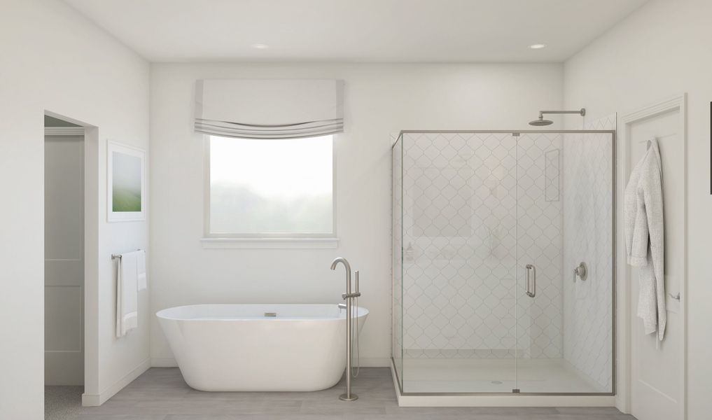 Primary bath with freestanding tub and glass shower enclosure