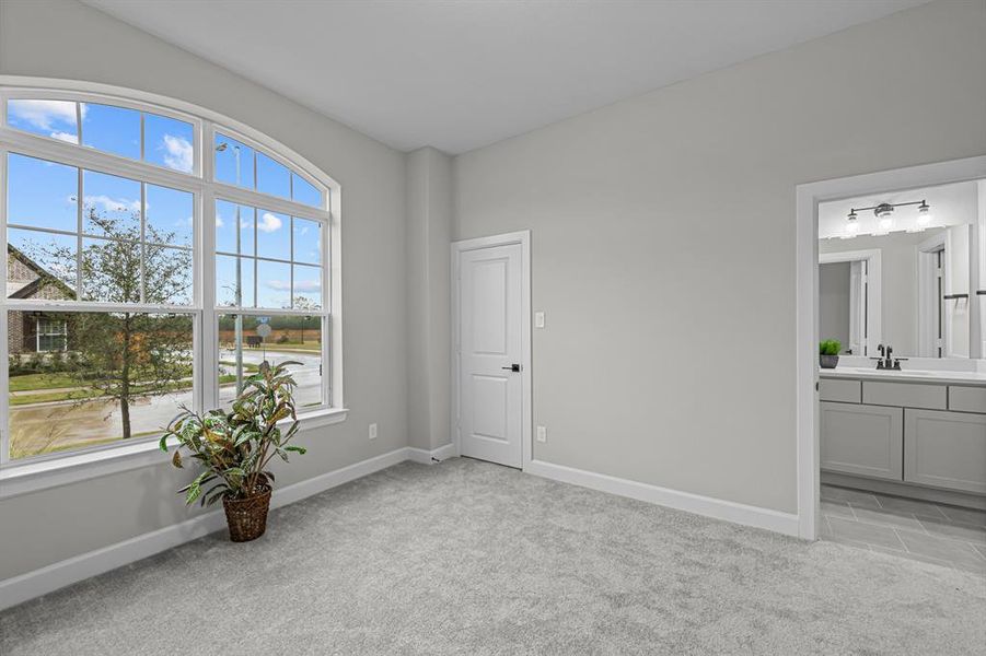 Beautiful windows at front 2ndary bedroom, that offers a walk-in closet & connecting bath!