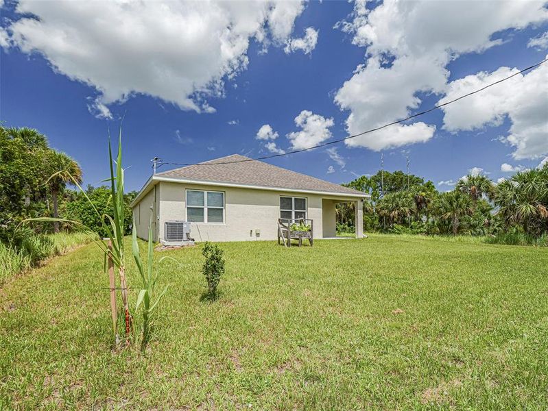 Front exterior of a new home in , Palm Bay, FL, highlighting curb appeal (Image 22). Front exterior of a new home in , Palm Bay, FL, highlighting curb appeal (Image 22).