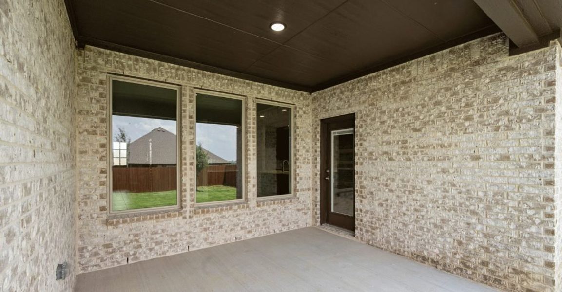 Representative exterior photo of a completed home built from the Donnington by Impression Homes in Still Water Lake, Godley, TX (Image 27).