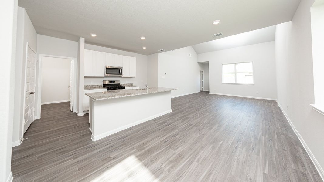 Dining Area to Kitchen and Family Room Dining Area to Kitchen and Family Room