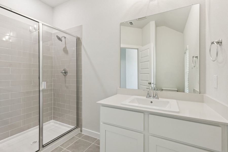Primary Bathroom in the Masters home plan by Trophy Signature Homes – REPRESENTATIVE PHOTO Primary Bathroom in the Masters home plan by Trophy Signature Homes – REPRESENTATIVE PHOTO