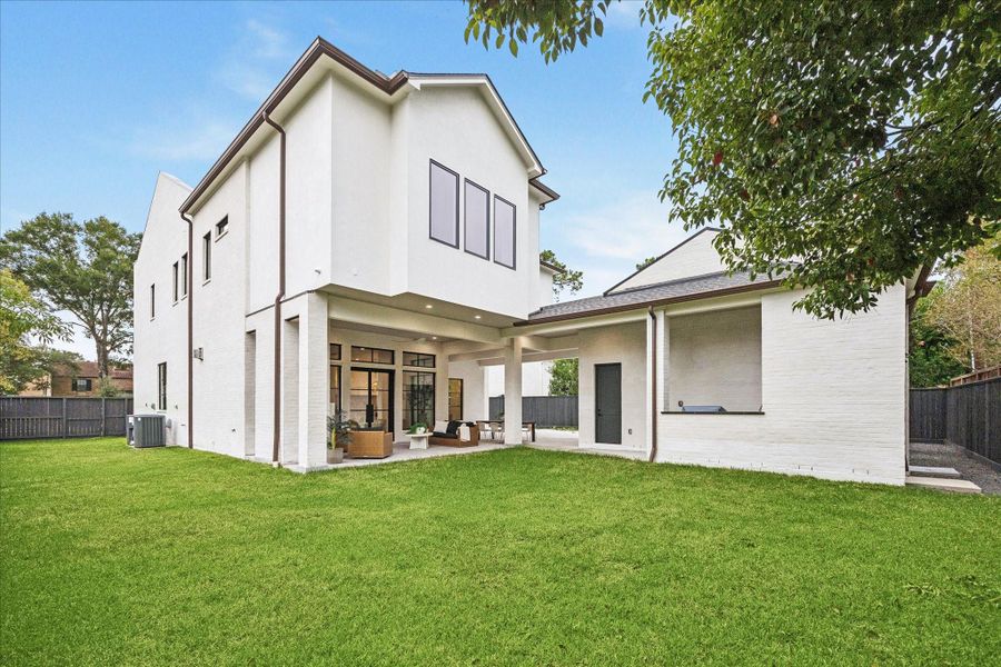 A generous lawn provides space for a pool, gardening, or play. The home is pre-plumbed for a Generac system for added peace of mind.