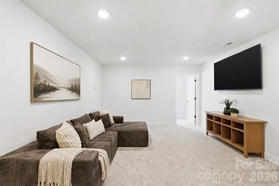 Spacious upstairs bonus room offering a versatile layout ideal for a media room, playroom, or gym.
