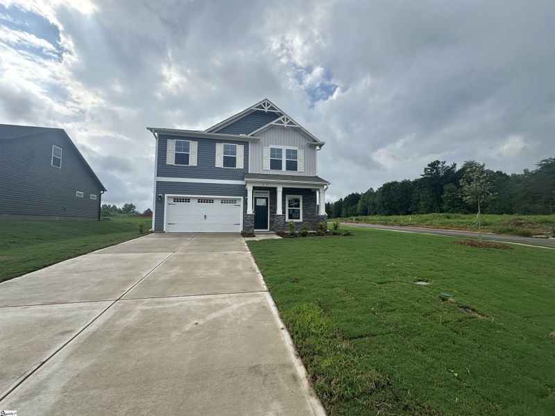Front exterior of a new home in Shiloh Trail, Wellford, SC, highlighting curb appeal (Image 16). Front exterior of a new home in Shiloh Trail, Wellford, SC, highlighting curb appeal (Image 16).