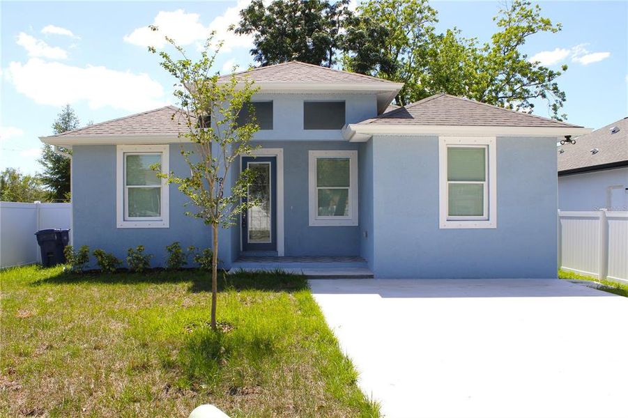 Front exterior of a new home in , Tampa, FL, highlighting curb appeal (Image 23).