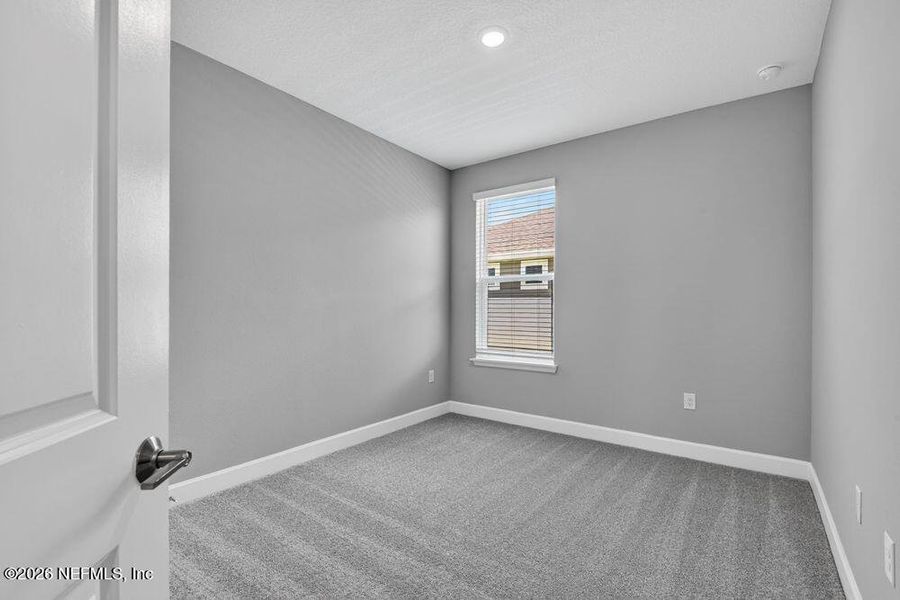 Spacious, unfurnished interior of a new home in Colbert Landings, Palm Coast (Image 31).