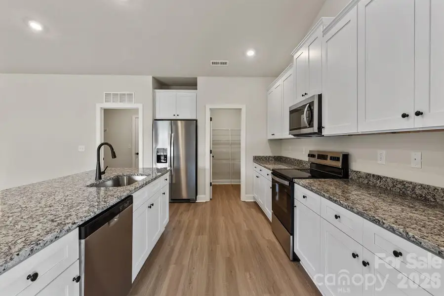 Furnished interior view inside a new home in Ascot Woods, Charlotte (Image 6).
