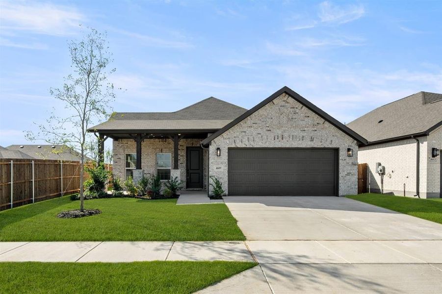 Front exterior of a new home in Summer Crest, Fort Worth, TX, highlighting curb appeal (Image 2).