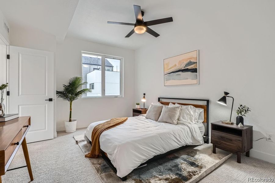 Generously sized retreat with natural light, large closet, and ensuite. Ceiling fan included