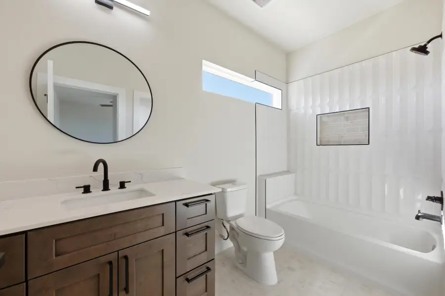 Bathroom with vanity and shower / bathtub combination