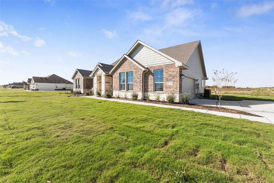 Front exterior of a new home in Clear Sky Addition, Valley View, TX, highlighting curb appeal (Image 2). Front exterior of a new home in Clear Sky Addition, Valley View, TX, highlighting curb appeal (Image 2).