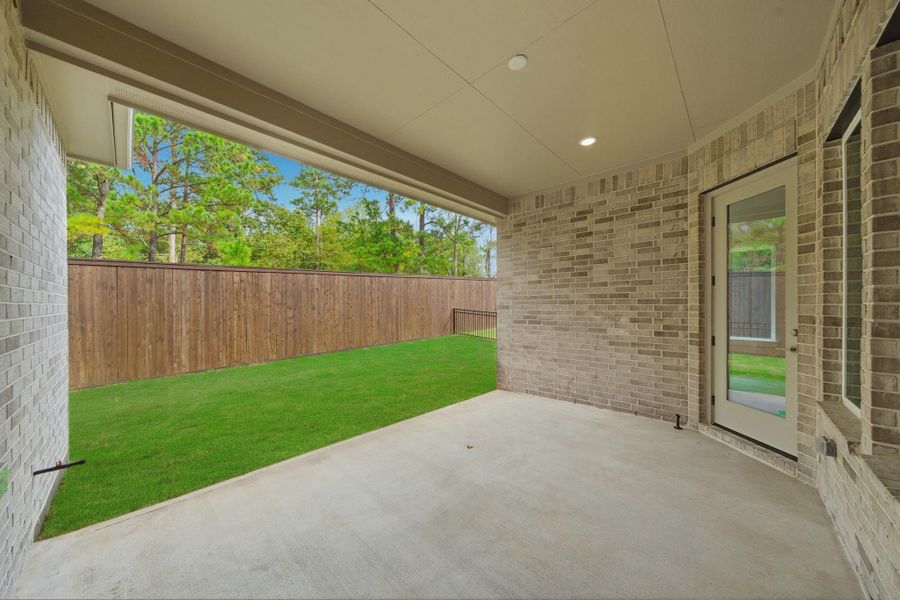Private backyard retreat with no rear neighbors and an 8-ft wooden privacy fence—perfect for relaxing or entertaining.