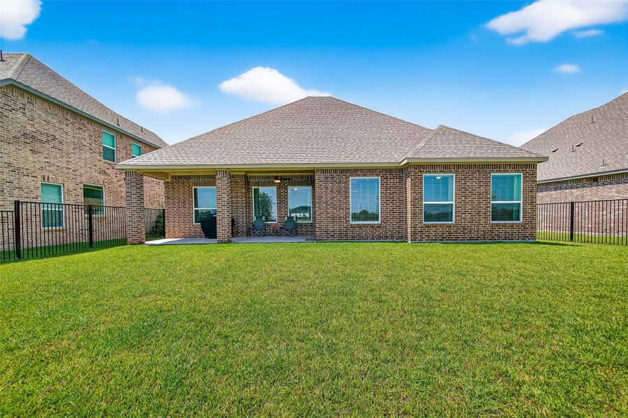 Front exterior of a new home in Sierra Vista, Iowa Colony, TX, highlighting curb appeal (Image 21). Front exterior of a new home in Sierra Vista, Iowa Colony, TX, highlighting curb appeal (Image 21).