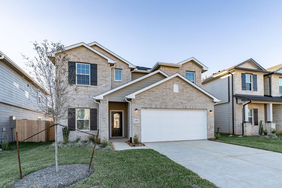 Front exterior of a new home in Cielo, Conroe, TX, highlighting curb appeal (Image 17).