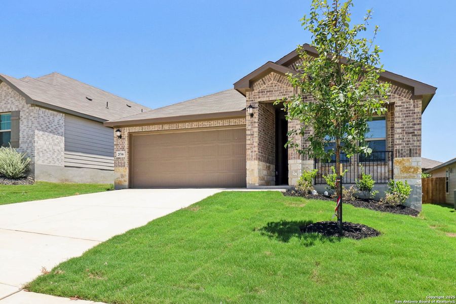 Front exterior of a new home in Scenic Crest - Premier Series, Boerne, TX, highlighting curb appeal (Image 19). Front exterior of a new home in Scenic Crest - Premier Series, Boerne, TX, highlighting curb appeal (Image 19).