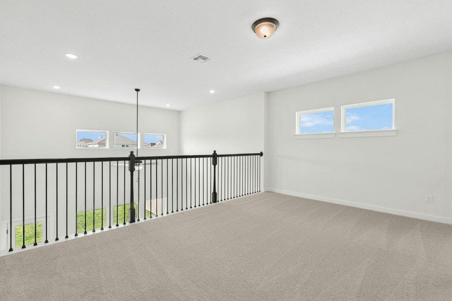 Empty room featuring carpet and recessed lighting