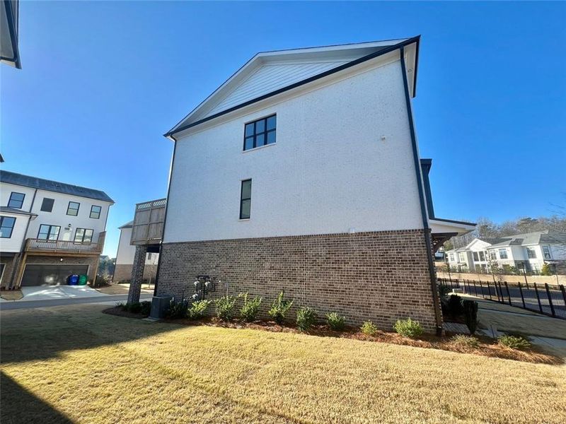 Front exterior of a new home in , Buford, GA, highlighting curb appeal (Image 1).
